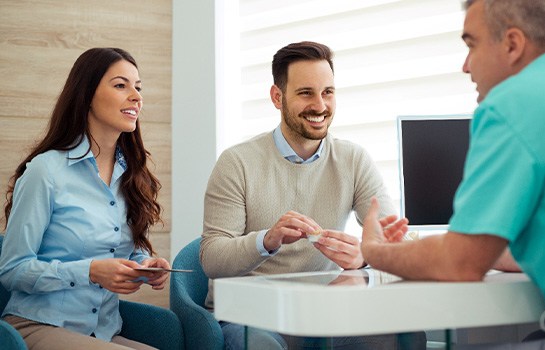 Couple smiles at dentist